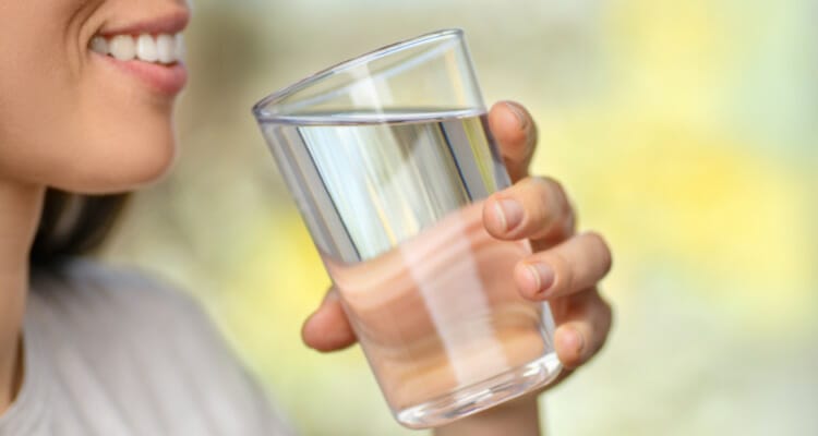What are the benefits of drinking water to flush out alcohol?