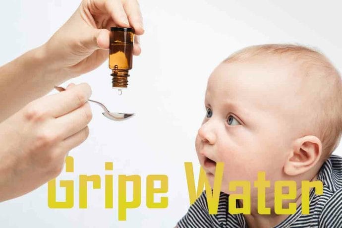 Mother feeding baby boy with liquid medicine Mother feeding baby boy with liquid medicine
