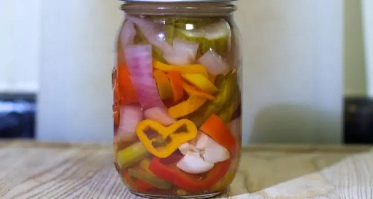 How To Do Water Bath Canning (A Step-By-Step Guide) 6 fill the jar